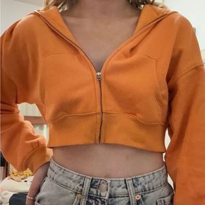orange divided cropped zip up hoodie. size small